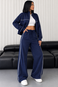Conjunto deportivo de chaqueta y pantalón ancho a rayas